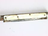 a knife that is laying on a table