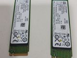 a close up of two memory modules on a white surface