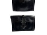 a pair of black leather wallets on a white background