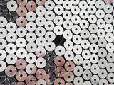 many rolls of toilet paper sitting on the floor