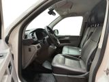 the interior of a car with the door open and the driver ' s seat down