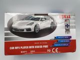 an image of a white car with a remote control in front of it