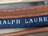 the label on the back of a tan and brown bag