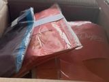 a box full of clothes and a pair of flip flops