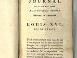 un livre écrit posé sur une table