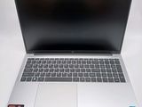 an open laptop computer sitting on top of a white table