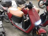 many motorcycles that are parked in a parking lot