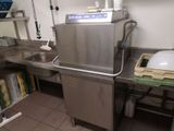 a stainless steel sink in a commercial kitchen
