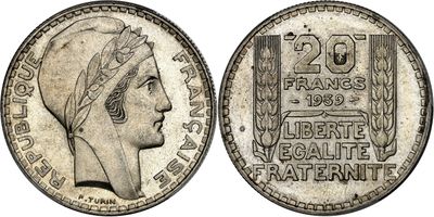 a silver coin with a woman ' s head on it