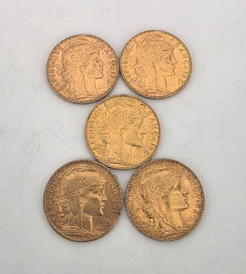 five gold coins are arranged in a triangle on a white surface