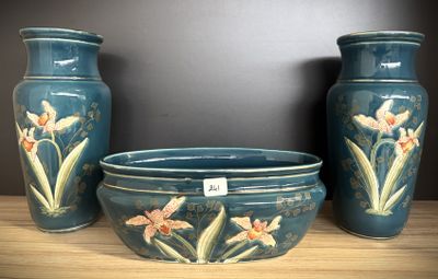 three vases sitting on a table with a tag on them