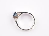 a close up of a ring on a white surface