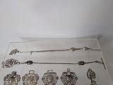 a glass display case with a lot of silver items