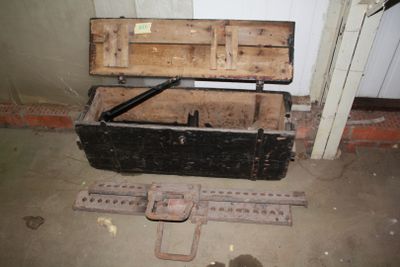 an old wooden chest with a metal latch on it