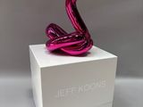 jeff koons sculpture in a white box with a pink snake on top