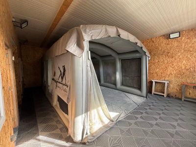 a room with a tent and a table in it