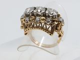 an image of a gold and silver ring with diamonds