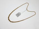 a close up of a gold chain with a tag on it