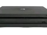 two black laptops stacked on top of each other on a white surface