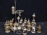 many different types of antique brass items on a table