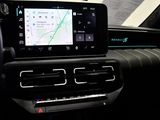 the dashboard of a car with a gps device in the center