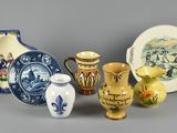 many different vases that are sitting on a table