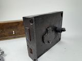 a small wooden box with a latch on it