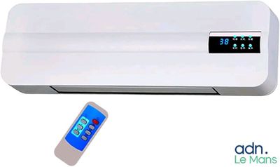 an image of a white air conditioner sitting next to a remote control