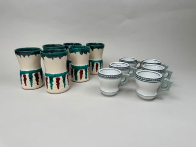 six cups and six saucers are sitting next to each other