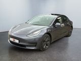 the tesla model 3 is parked in the showroom at the showroom