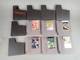 a lot of nintendo games sitting on a table