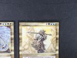 two cards that are sitting on a table
