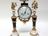 a clock that is sitting on top of a table