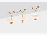 three light brass chandelier with frosted glass shades
