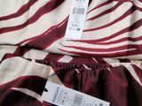 a close up of a zebra print dress with a price tag on it
