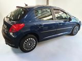 a picture of a small blue car parked in a garage