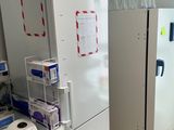 two refrigerators that are sitting next to each other in a room