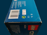 a box of toothpaste sitting on a blue surface