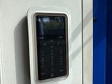 an image of a smart phone mounted to a wall