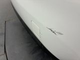 a close up of a car ' s bumper with scratches on it