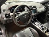 the interior of a car with a steering wheel, dashboard and dashboard controls