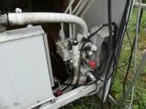 a white machine that is sitting in the grass