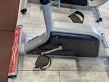 a stationary exercise bike on the floor in the gym
