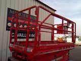 a picture of a red work platform in front of a building