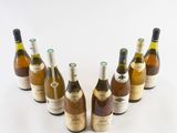 several bottles of wine are lined up in a circle