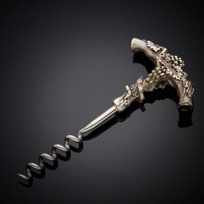 a silver bottle opener with a cork opener on a black background
