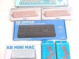 a keyboard, mouse, mouse pad, and other electronic items on a table