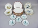 many plates and bowls that are sitting on a table