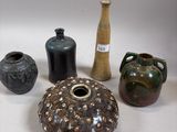 many different types of vases on the table
