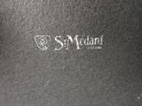an image of a close up of the logo on the back of a black bag